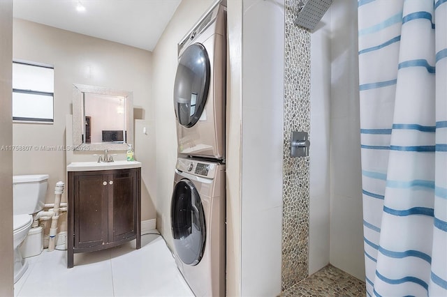 laundry room featuring laundry area, stacked washing maching and dryer, a sink, and light tile patterned flooring