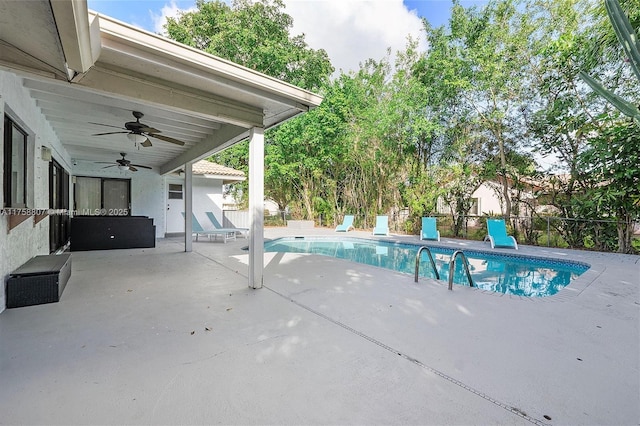 view of pool with a patio area, ceiling fan, fence, and a fenced in pool