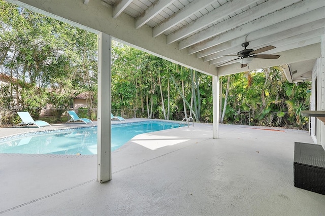 pool with ceiling fan, a patio, and fence