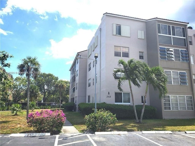 view of property with uncovered parking