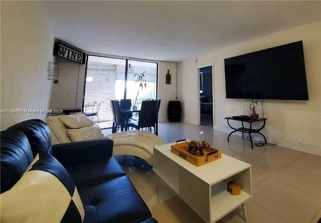 living area featuring expansive windows and tile patterned floors