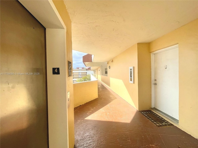 hallway featuring vaulted ceiling