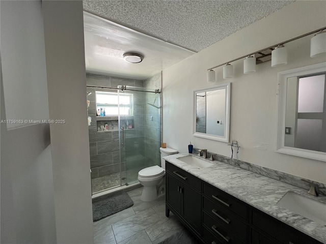 full bath with a stall shower, marble finish floor, a sink, and toilet