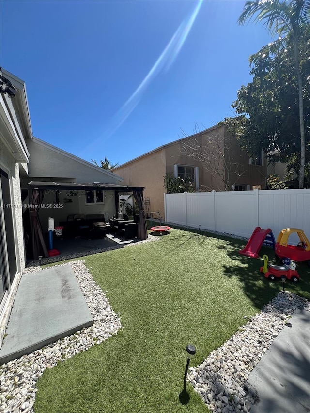 view of yard featuring a patio and fence