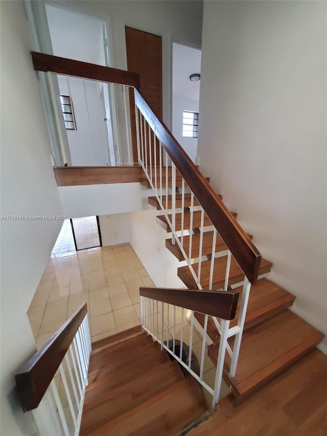 stairs with wood finished floors