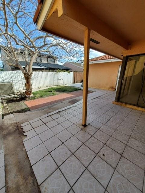 view of patio featuring fence