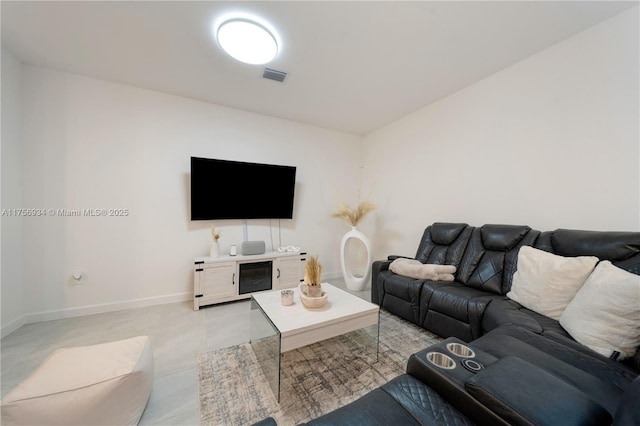 living room featuring visible vents and baseboards