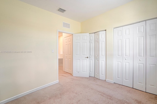 9399 W 33rd Ln # 1, Hialeah, FL 33018 - unfurnished bedroom featuring baseboards, carpet flooring, two closets, and visible vents