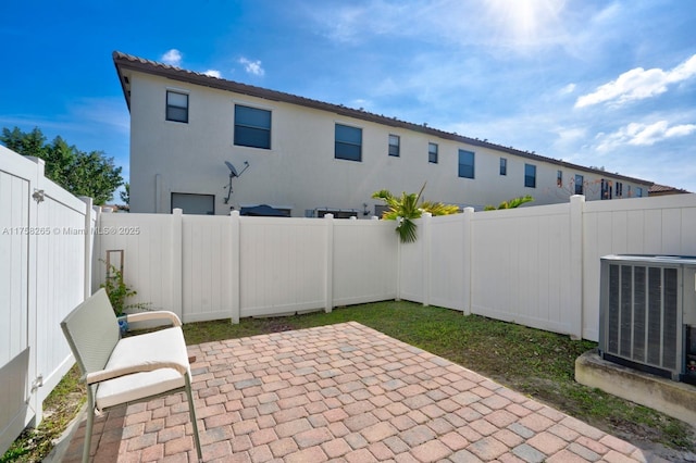 9399 W 33rd Ln # 1, Hialeah, FL 33018 - view of patio / terrace featuring central AC unit and a fenced backyard