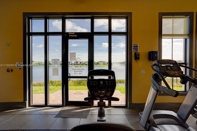 9399 W 33rd Ln # 1, Hialeah, FL 33018 - gym featuring baseboards and a water view