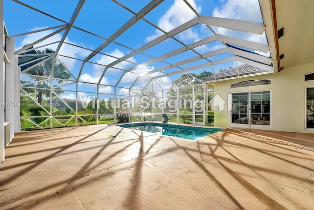 pool with a patio and a lanai