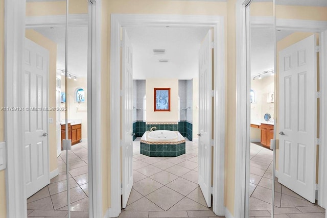 hallway with light tile patterned floors