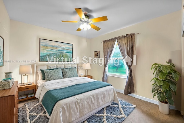 carpeted bedroom featuring a ceiling fan and baseboards