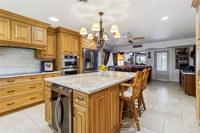 kitchen featuring visible vents, wine cooler, appliances with stainless steel finishes, and light tile patterned flooring