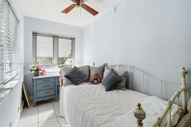 bedroom featuring ceiling fan and light tile patterned flooring