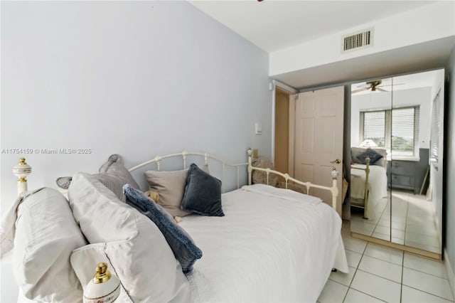 bedroom featuring light tile patterned floors and visible vents