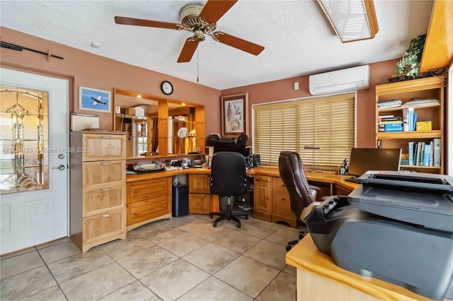 office area with a ceiling fan, a wall unit AC, a textured ceiling, and light tile patterned floors