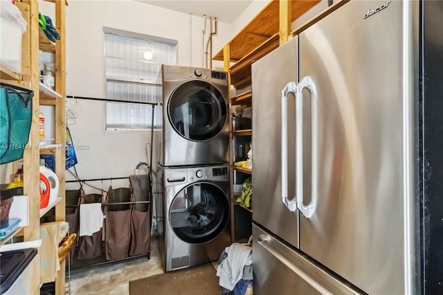 washroom featuring laundry area and stacked washer / drying machine