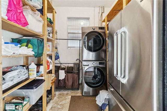 clothes washing area with laundry area and stacked washer / dryer