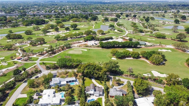 aerial view featuring view of golf course, a water view, and a residential view