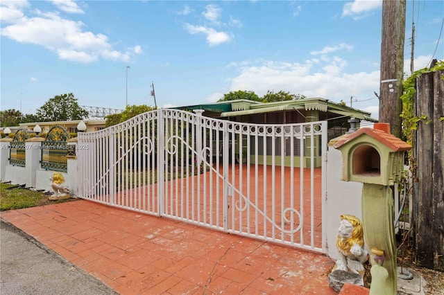 view of gate with fence