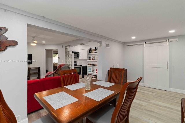 400 S 62nd Ter, Hollywood, FL 33023 - dining area featuring light wood-style floors, recessed lighting, baseboards, and a barn door