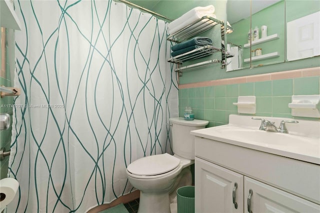 400 S 62nd Ter, Hollywood, FL 33023 - bathroom with toilet, a wainscoted wall, vanity, tile walls, and tile patterned floors