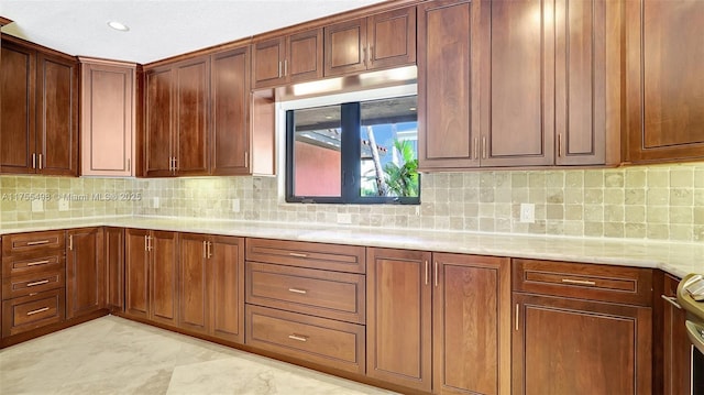 kitchen with recessed lighting and backsplash