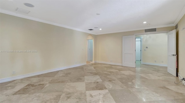 spare room featuring crown molding, baseboards, arched walkways, and visible vents