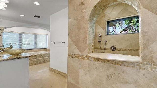 bathroom with a bath, a healthy amount of sunlight, recessed lighting, and a walk in shower