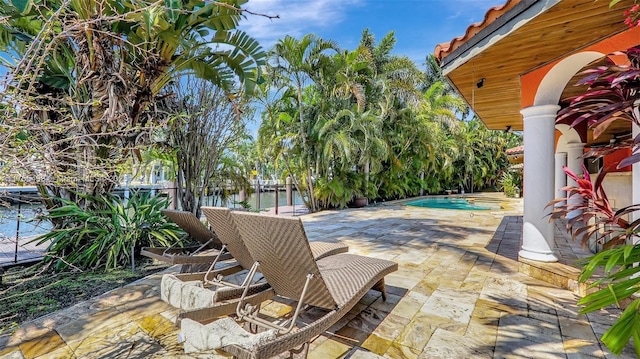 view of patio with an outdoor pool