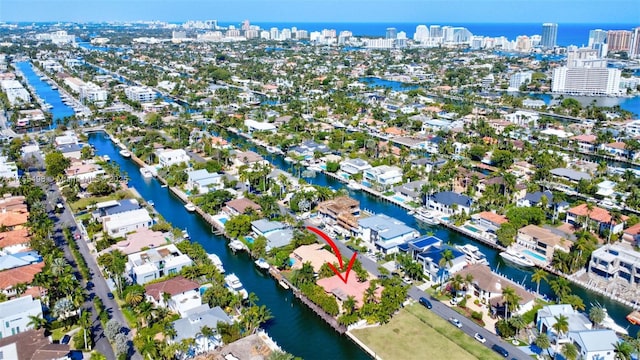 drone / aerial view with a water view and a residential view