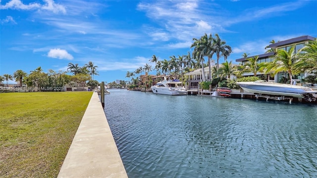 view of dock featuring a yard and a water view