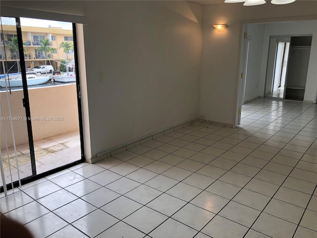 empty room with light tile patterned floors