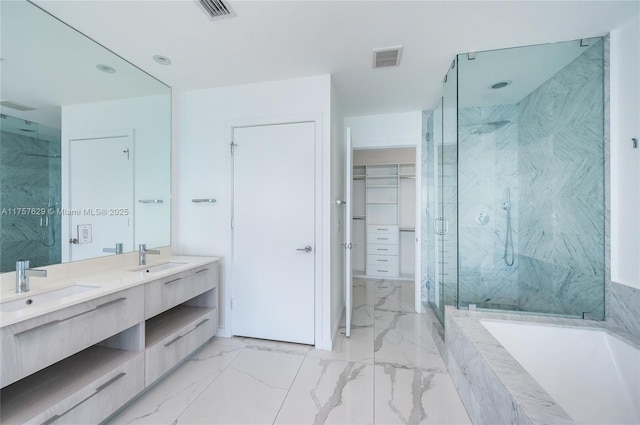 full bathroom featuring visible vents, marble finish floor, a sink, and a marble finish shower