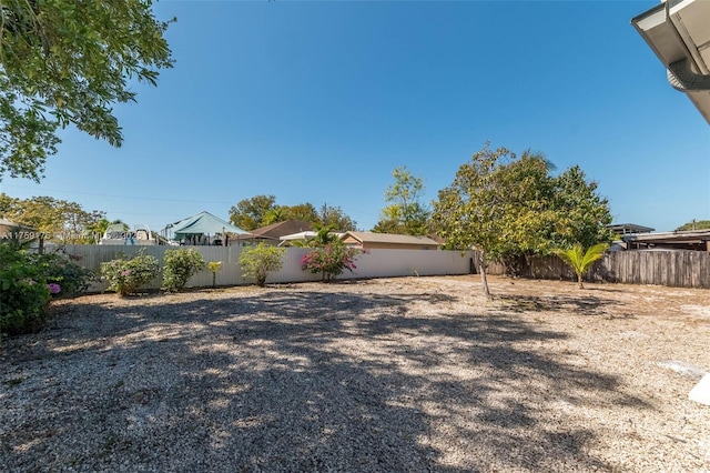 view of yard featuring a fenced backyard