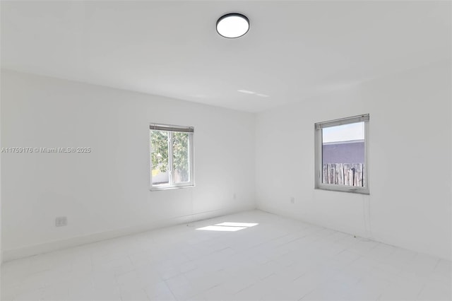 unfurnished room with plenty of natural light