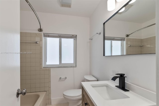 bathroom with toilet, visible vents, a wealth of natural light, and vanity