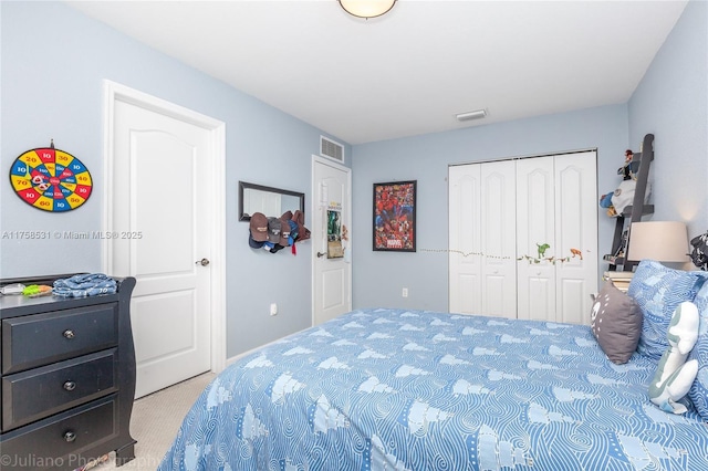 bedroom featuring a closet, carpet, and visible vents