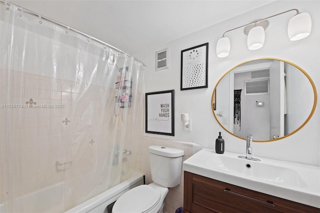 full bathroom featuring toilet, shower / bath combo, visible vents, and vanity