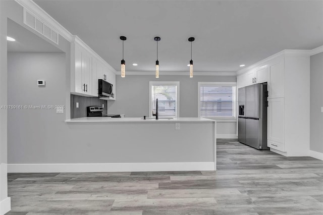 kitchen with stainless steel appliances, white cabinets, visible vents, and a sink