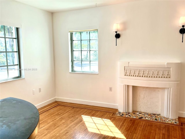 living area featuring wood finished floors and baseboards