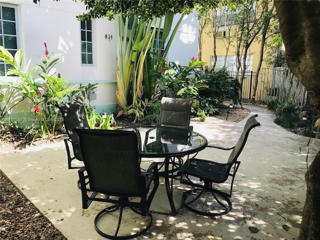 view of patio / terrace featuring outdoor dining area and fence