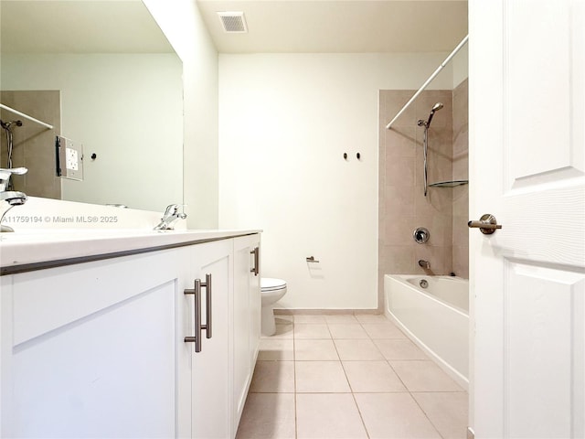 full bathroom with visible vents, toilet, tub / shower combination, vanity, and tile patterned flooring