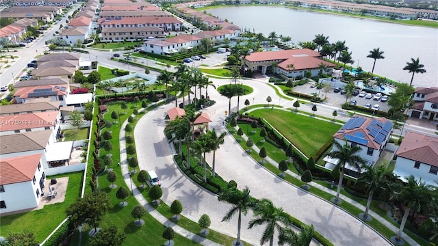 birds eye view of property featuring a water view and a residential view