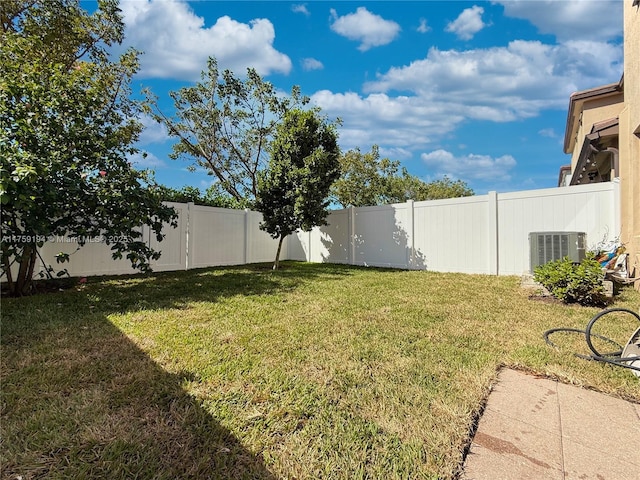 view of yard featuring a fenced backyard and cooling unit