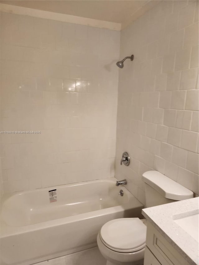 bathroom featuring  shower combination, vanity, and toilet