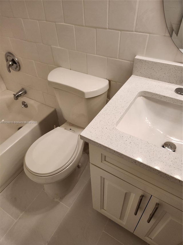 full bathroom featuring tile patterned flooring, vanity, toilet, and shower / bathtub combination