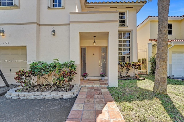 doorway to property with a tiled roof and stucco siding