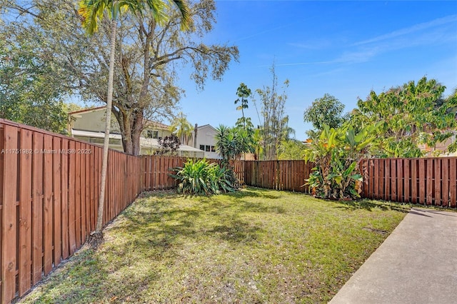 view of yard with a fenced backyard